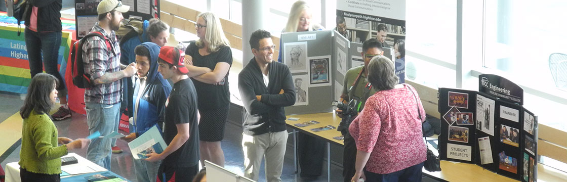 Highline College Opening Week Resource Fair with faculty talking with students